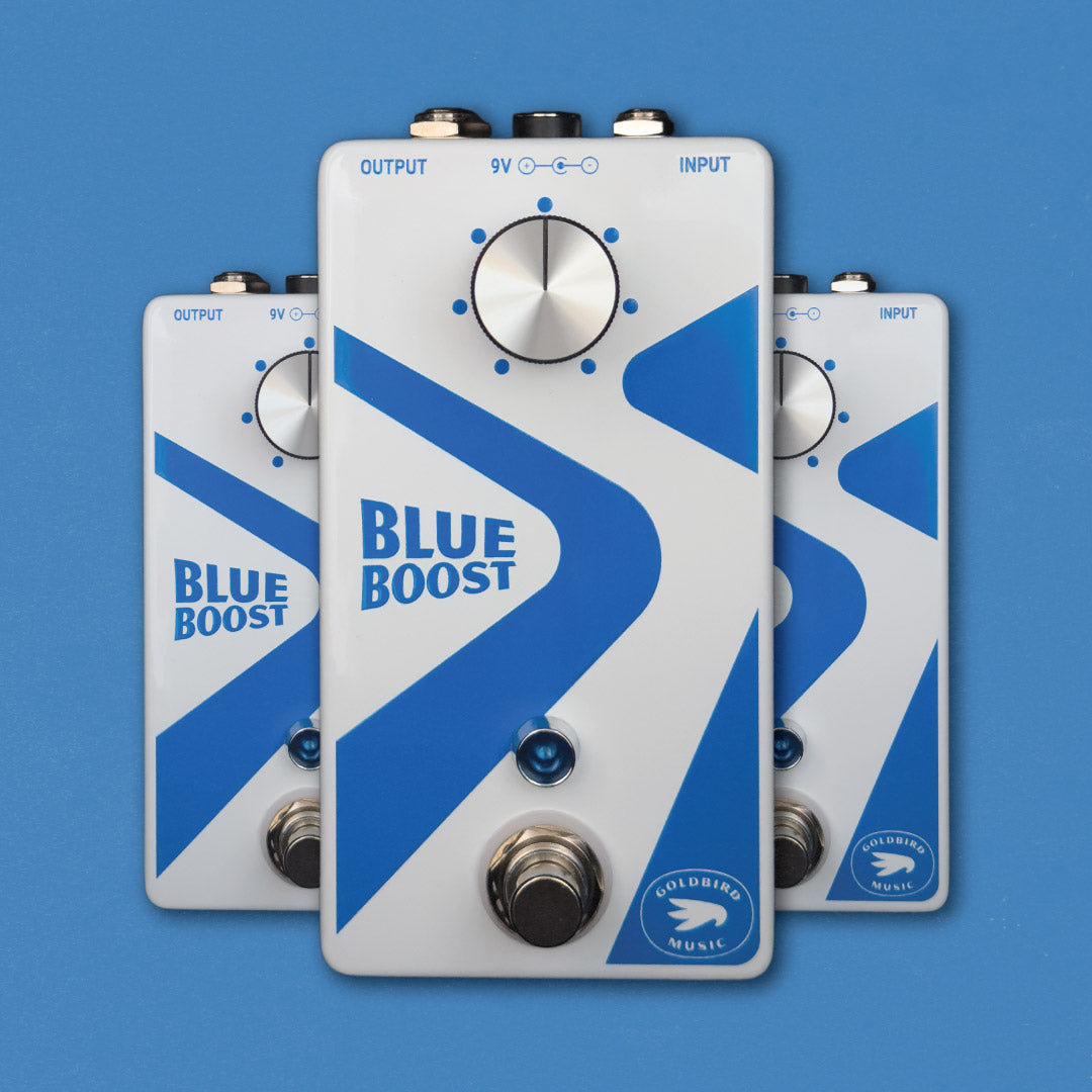 Three 'Blue Boost' guitar effect pedals on a blue background