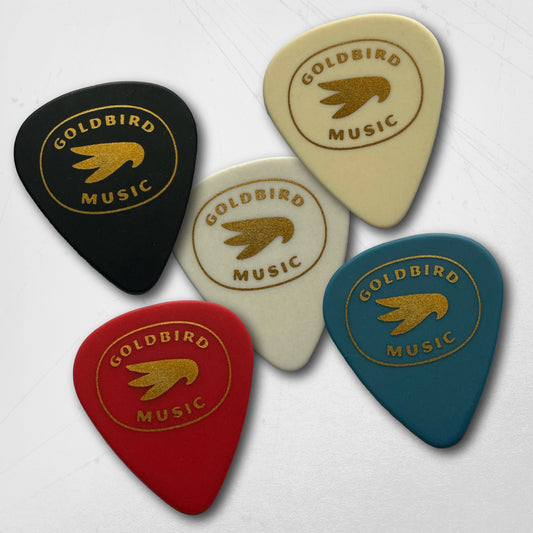 Five guitar picks with 'Goldbird Music' branding on a white background