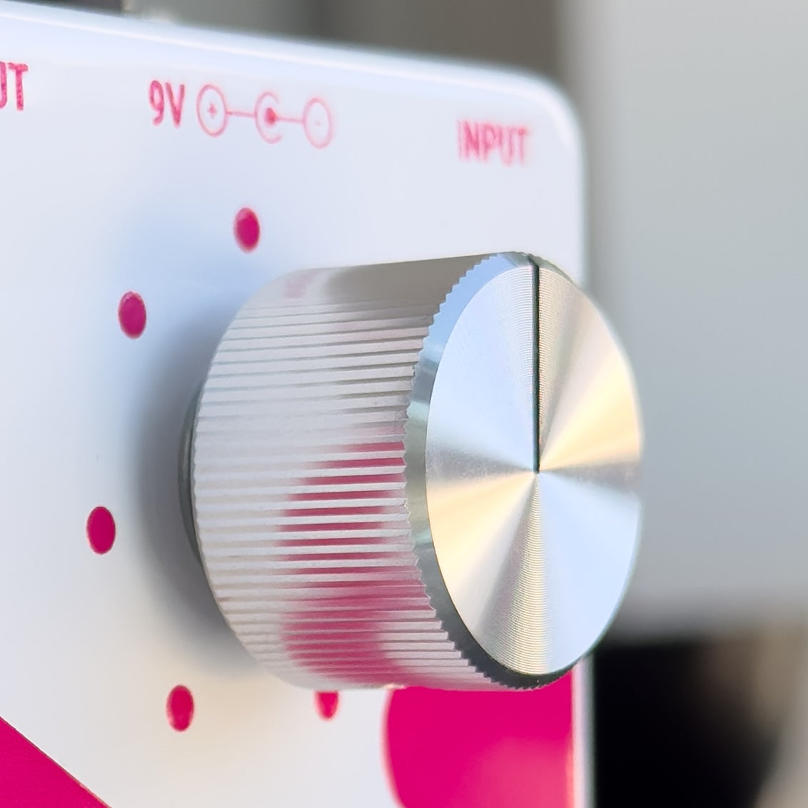 Close-up of the knob on the Pink Boost guitar pedal